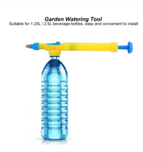 Garden watering tool attached to a blue beverage bottle