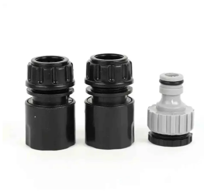 Three black and grey plumbing connectors.