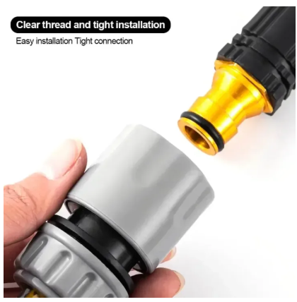 Close-up of a white fitting being attached to a gold and black fitting.